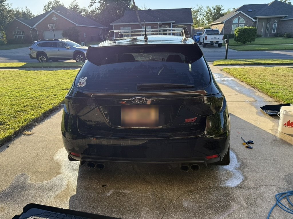 Rear view with quad exhaust tips and roof rack